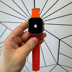 Apple Smartwatch with Vibrant Orange Strap